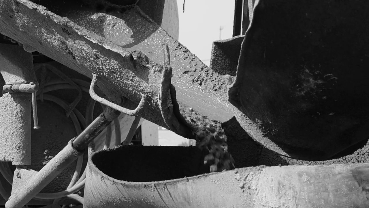 Fresh concrete discharging from a mixer chute