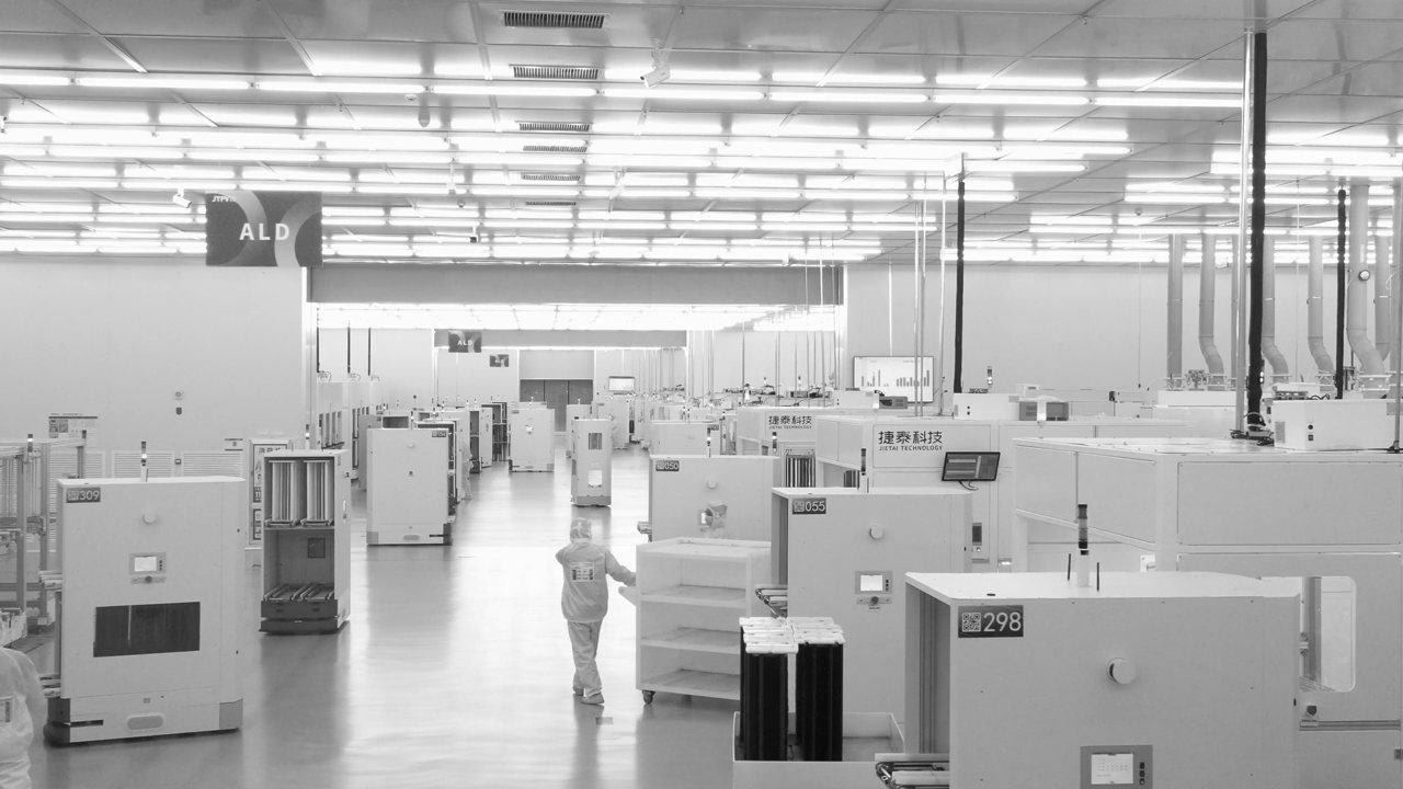 Silent looping clip of a semiconductor cleanroom floor lined with process tool bays.