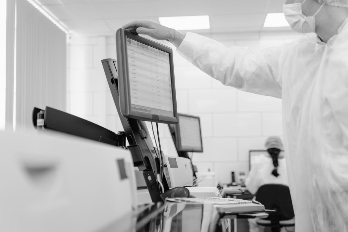 A researcher reading results from a screen before deciding what to run
